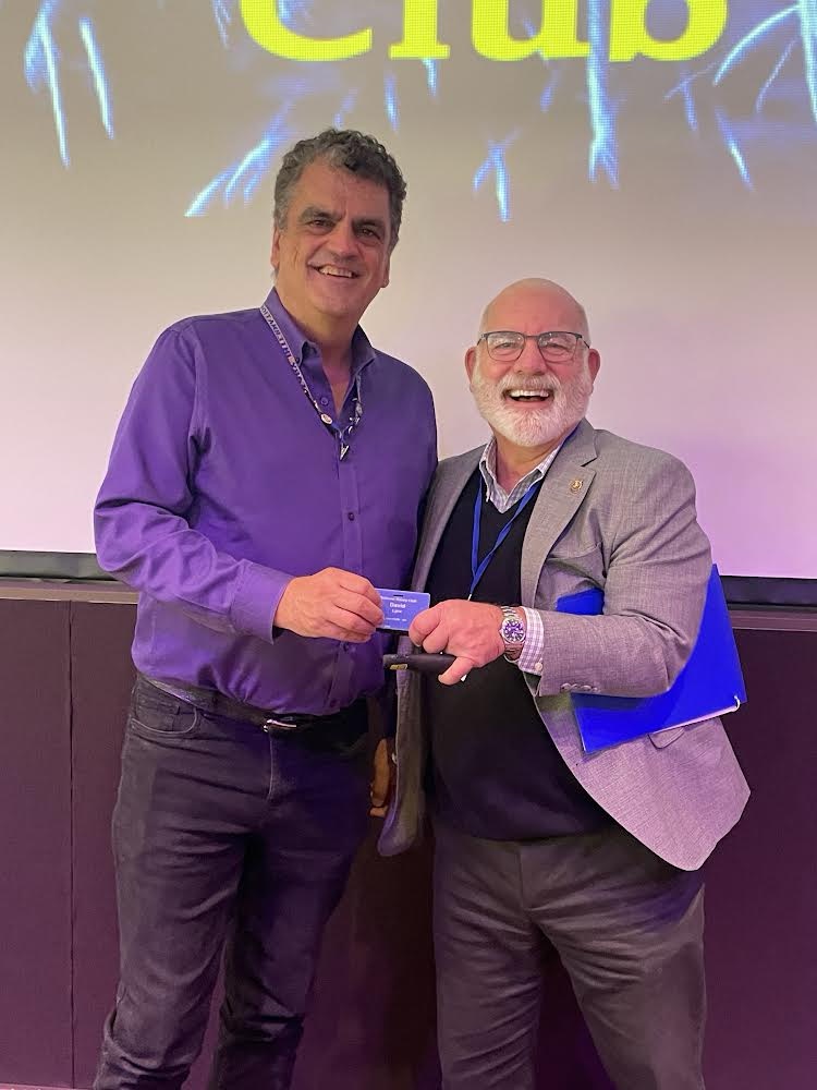 David Lynx receives his Blue badge from sponsor and President Tom